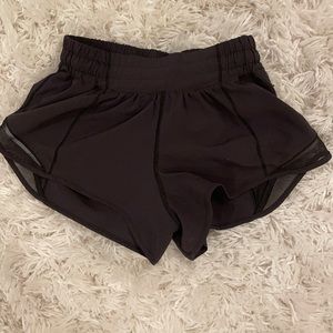 Size 2 black hotty hot lululemon shorts. In good condition!